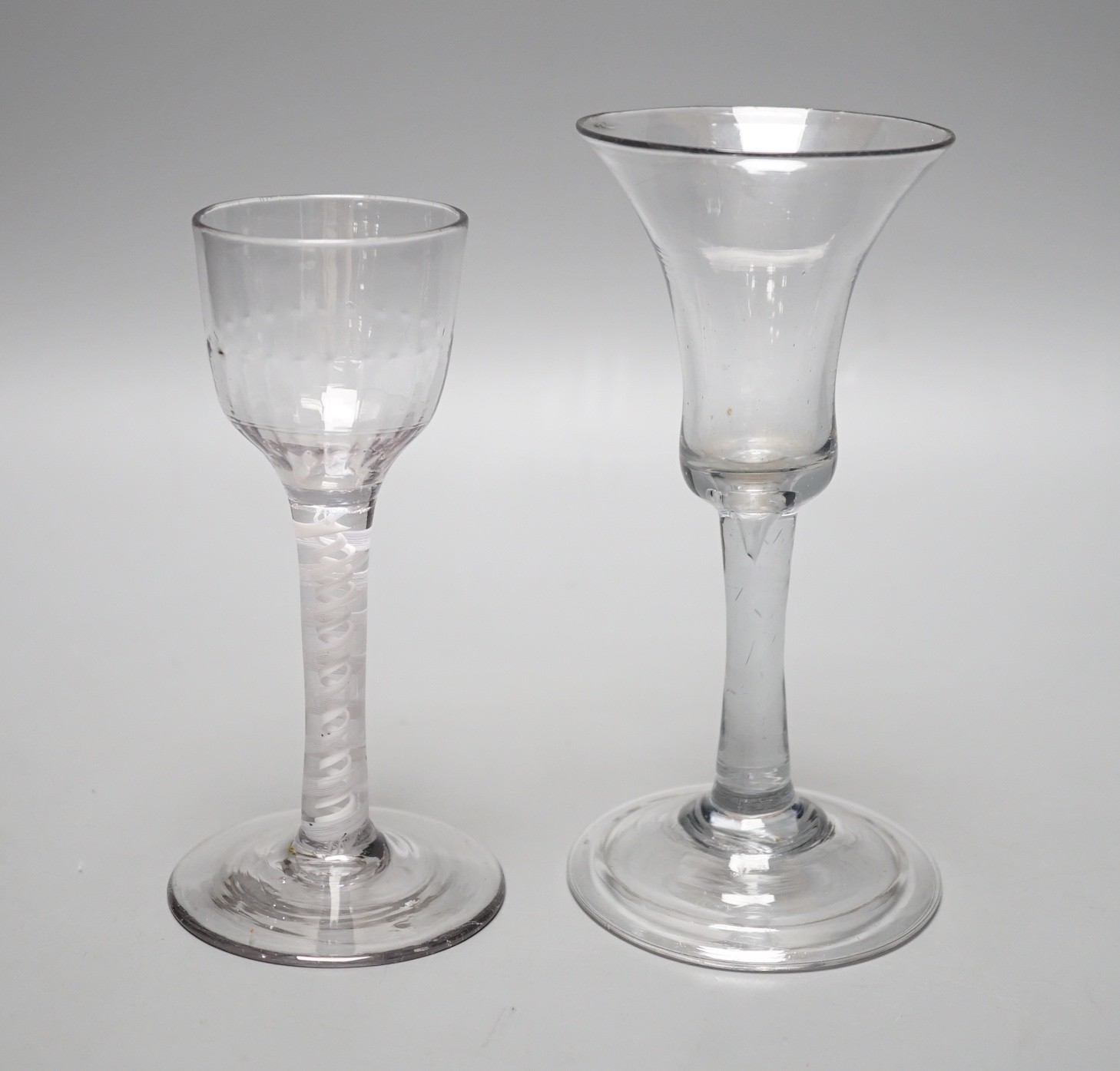 A George III dsot stem wine glass and a George II wine glass with folded foot, tallest 15.5cm